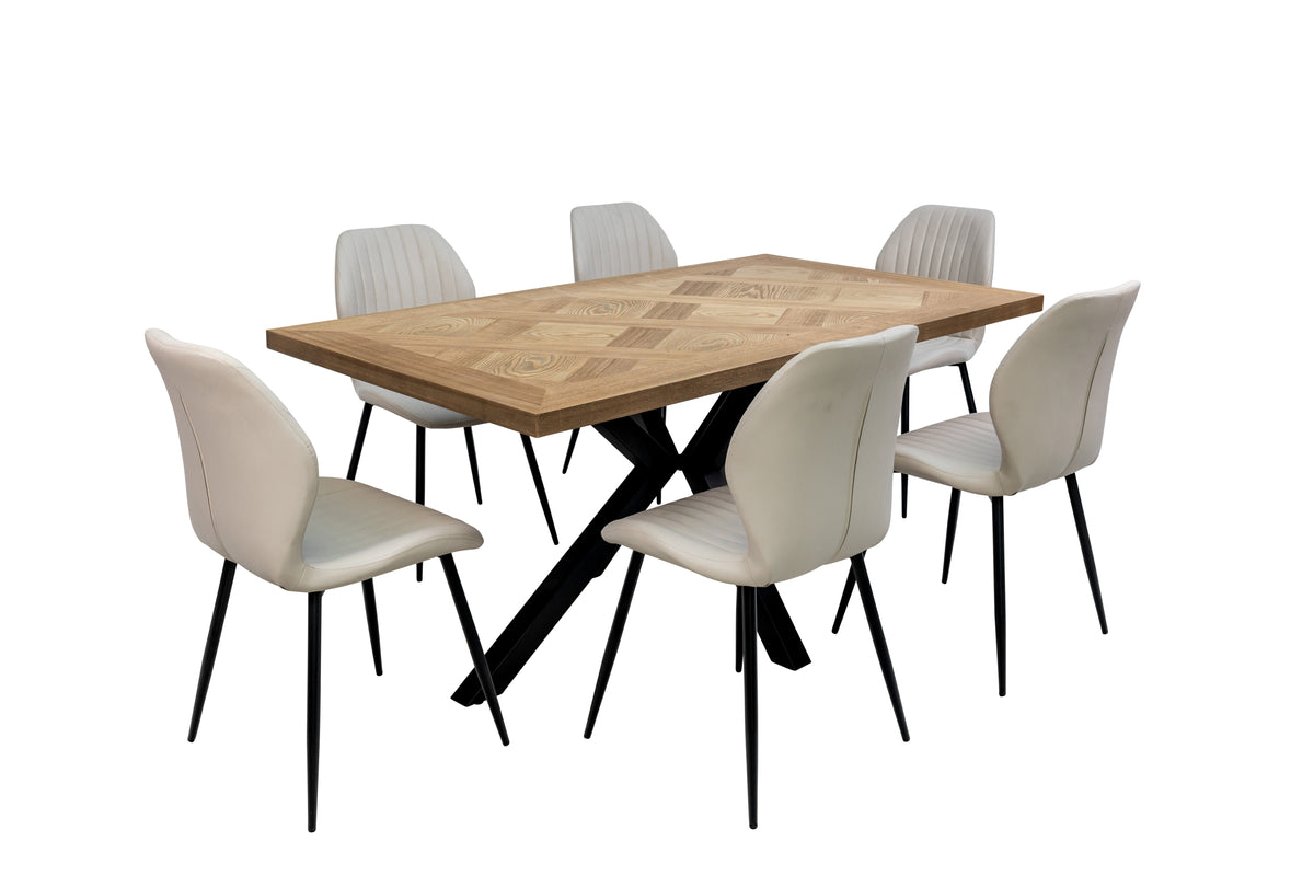 Wood veneer dining table with black X-style legs and four light chairs