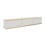 White TV cabinet with ribbed sliding doors and gold trim, low media console.
