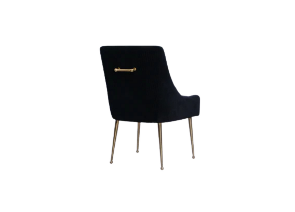 Black upholstered accent chair with brass bar detail on the back and metal legs