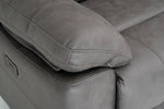Close-up of dark gray recliner seat cushion with visible stitching and seams.