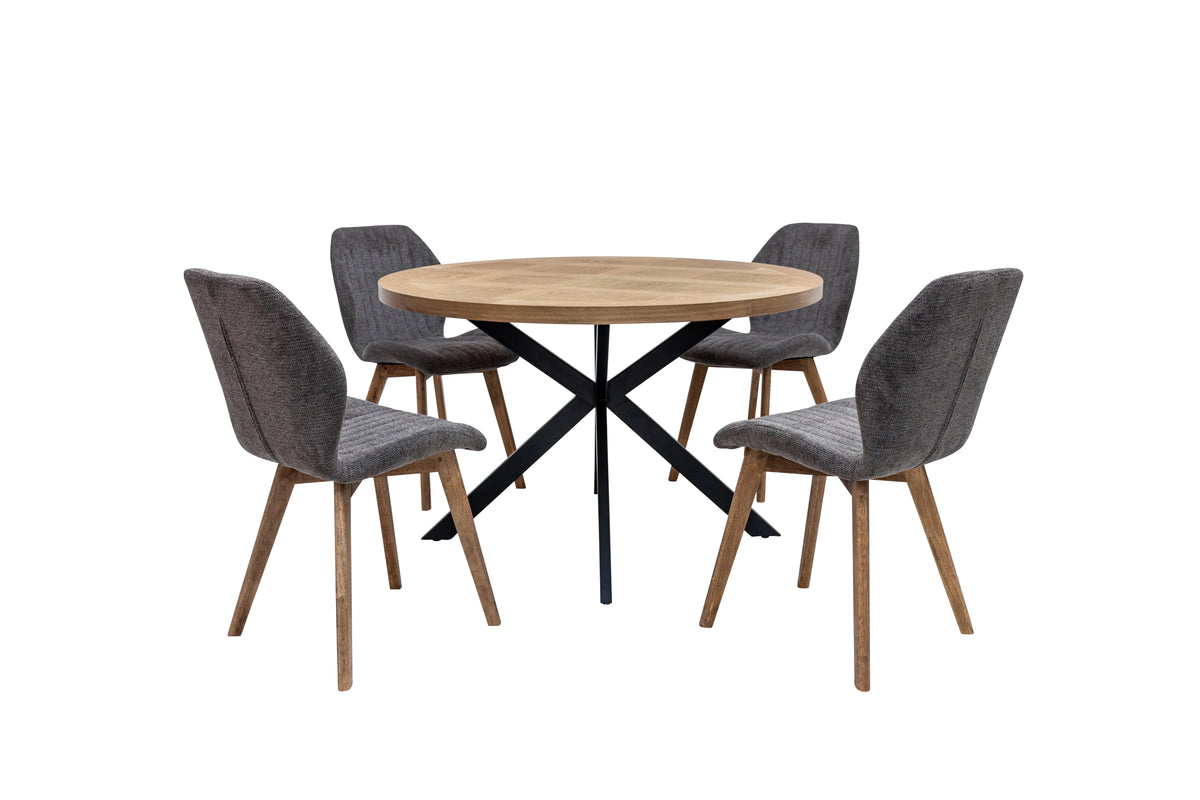 Round oak veneer dining table with black X base and four upholstered chairs