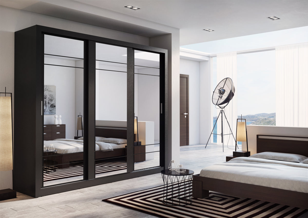 Sliding door wardrobe with dark frames and mirrored doors in a bedroom setting