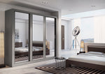 Sliding wardrobe with dark frames and mirrored sliding doors, storage compartments behind