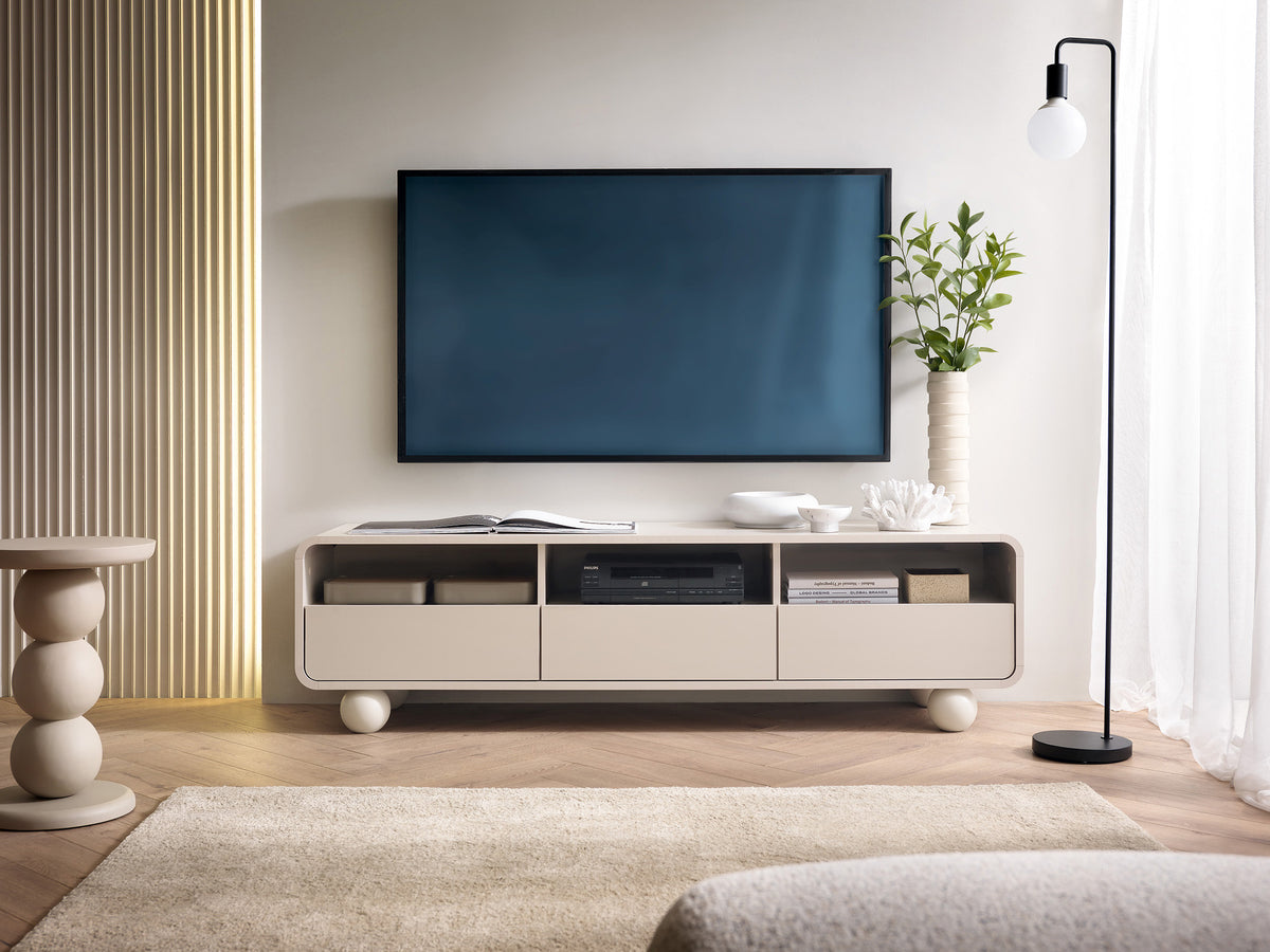 Light beige TV cabinet with open center shelf, two drawer doors, and round feet
