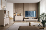 Light beige TV cabinet with open storage and drawers, mounted on round legs