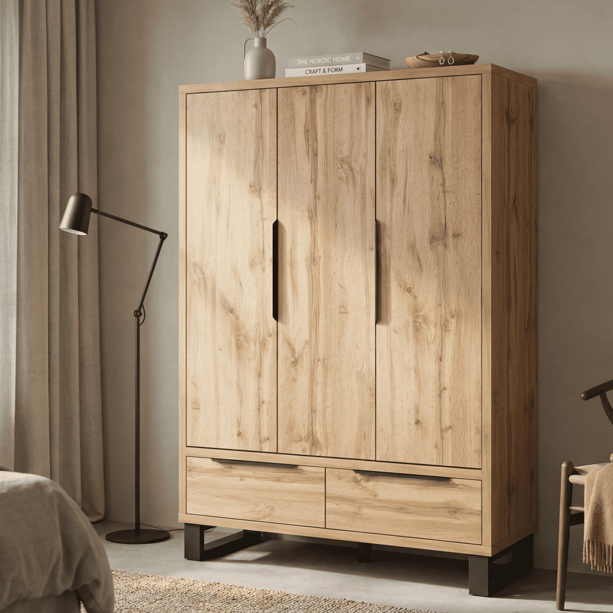 Light wood 3-door wardrobe with two drawers, vertical pulls, and dark feet