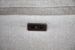 Grey fabric electric recliner sofa control panel on the seat