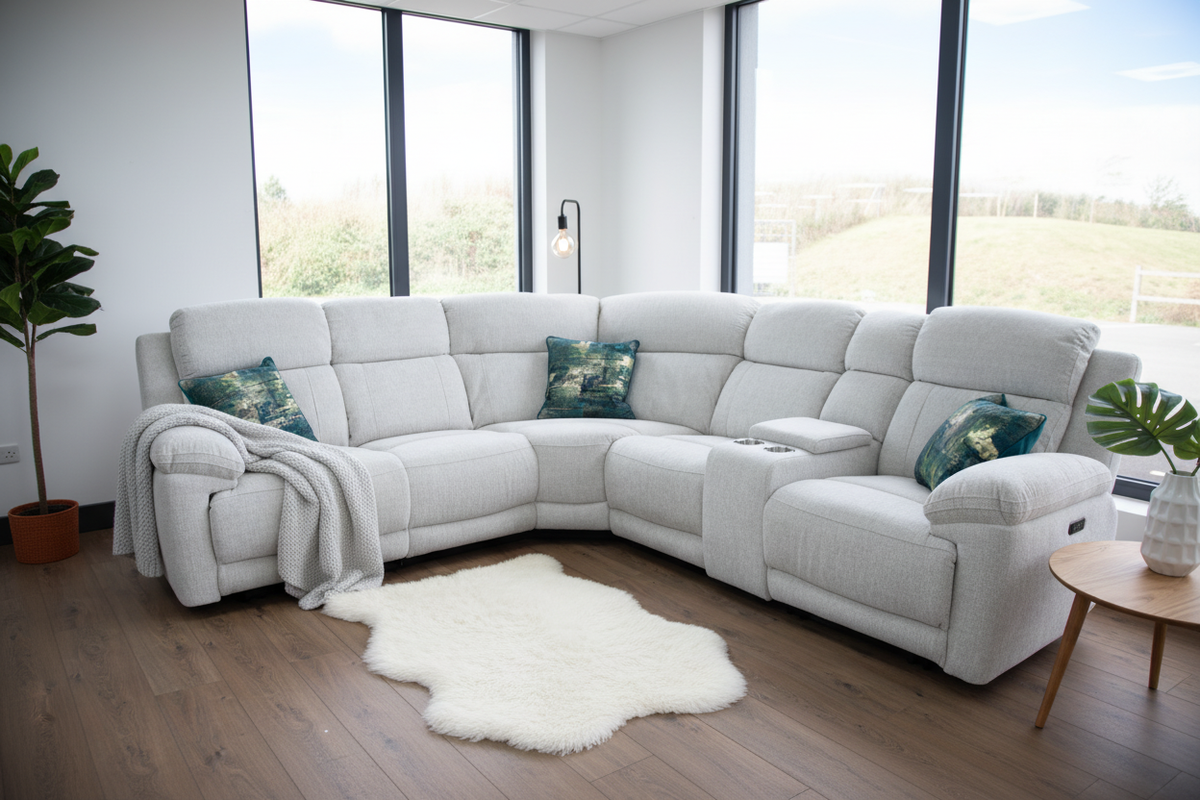 Grey electric recliner corner sofa with chaise seat and decorative pillows