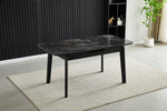Extendable dining table with dark ceramic tile top and black metal legs