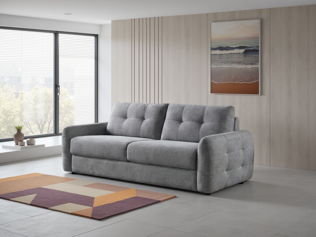 Grey 3-seater sofa bed with deep button-tufted back and rounded corner arms