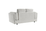 Light grey 2-seater sofa side view with padded armrests and three back cushions