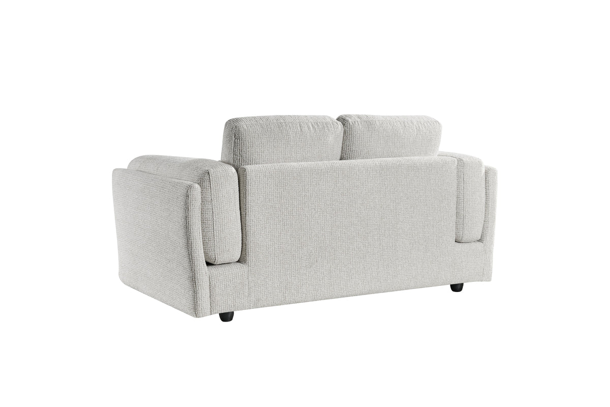 Light grey 2-seater sofa side view with padded armrests and three back cushions