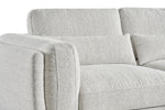 Light grey sofa upholstery close-up with cushioned arms and stacked back cushions