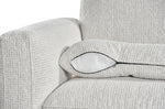 Light grey sofa arm and seat cushion detail with rounded corner and dark-trim seam