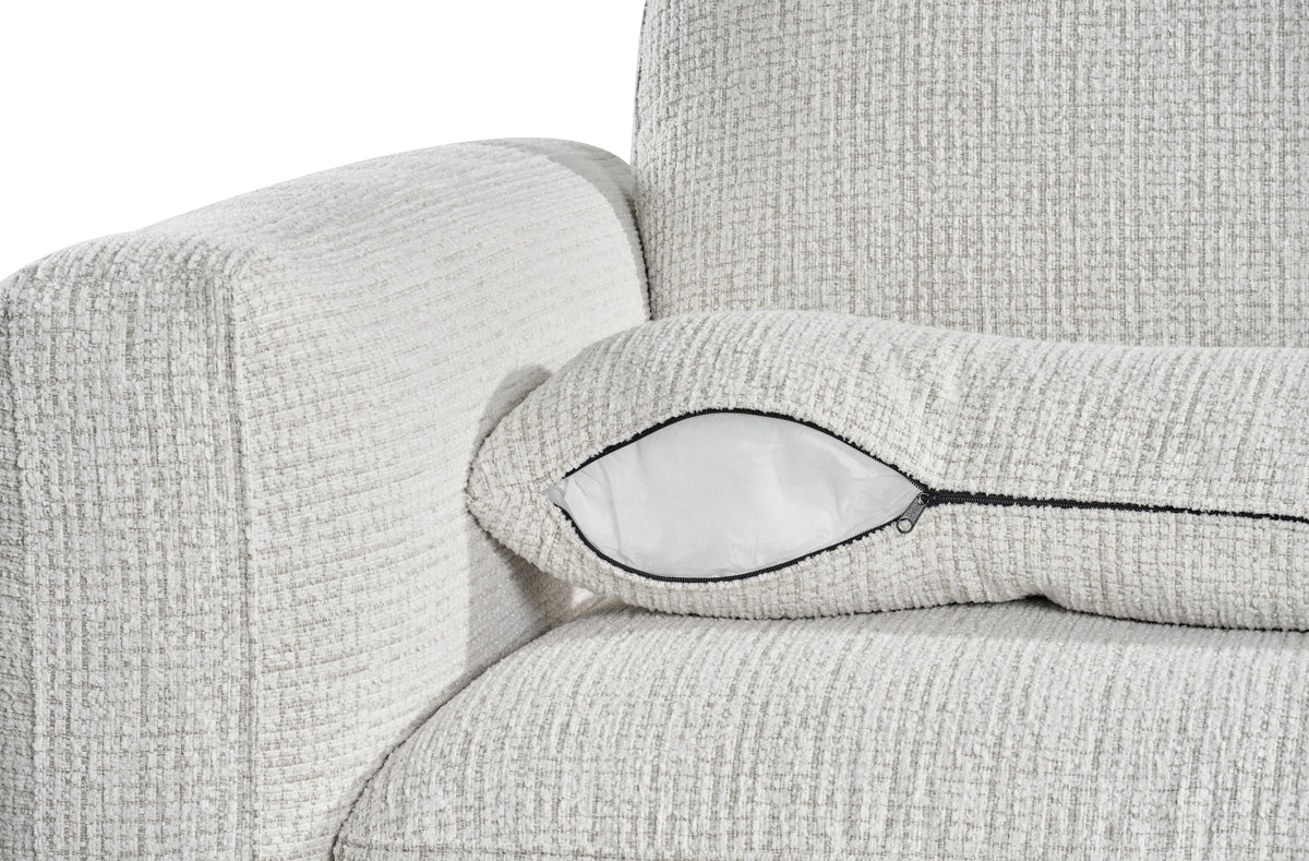 Light grey sofa arm and seat cushion detail with rounded corner and dark-trim seam