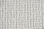 Light gray upholstery fabric close-up with textured woven pattern