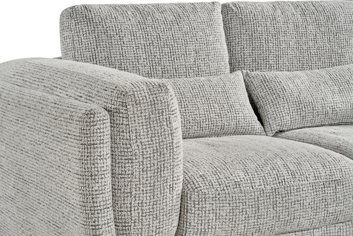 Light grey sofa seat and back cushion close-up with textured weave and piping