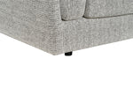Light gray armchair close-up of corner seam, fabric texture, and black legs