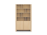 Light oak bookcase front view with cubby shelves and two panel doors.
