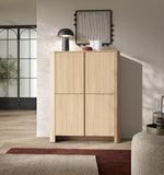 Light oak highboard with two doors and square panels, raised on slim legs