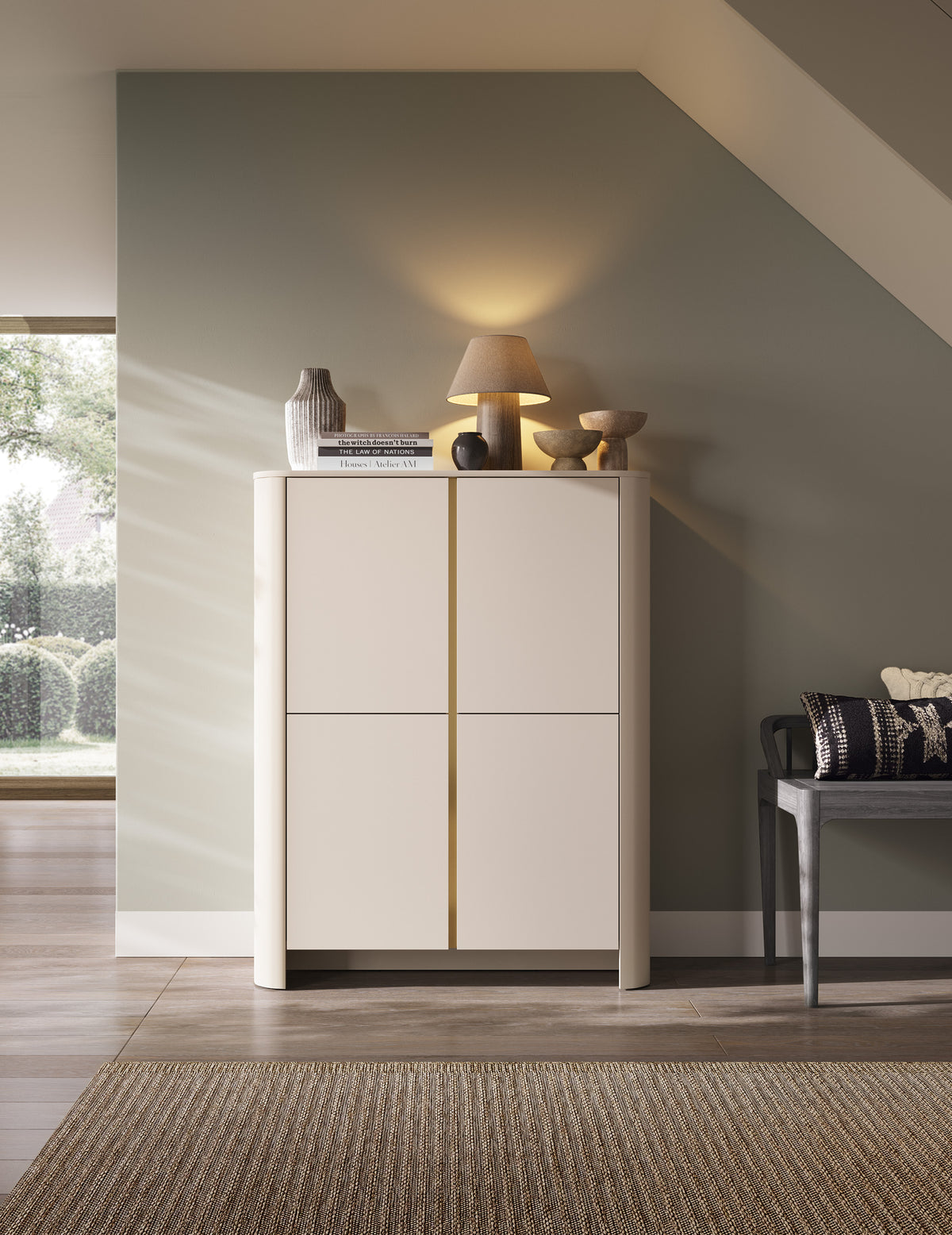 White highboard with gold vertical stripe and doors, styled with countertop decor on top