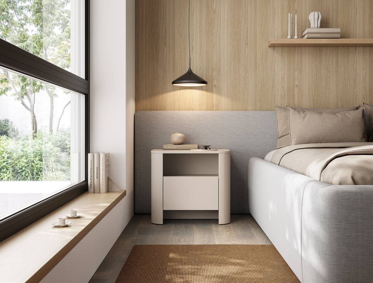 Light oak bedside cabinet with closed drawer and open shelf, styled near bed