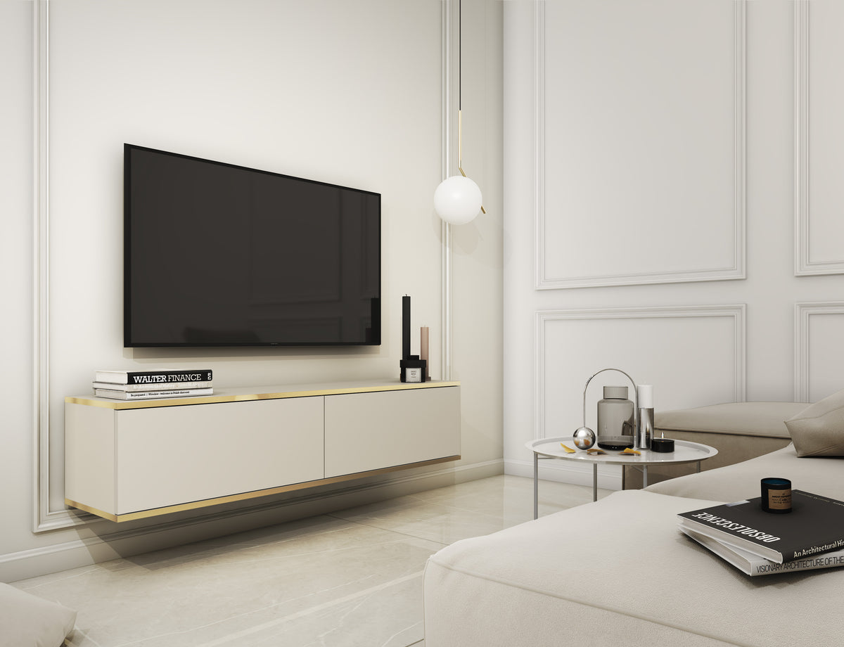 White two-door TV cabinet with gold trim, set beneath a flat-screen TV