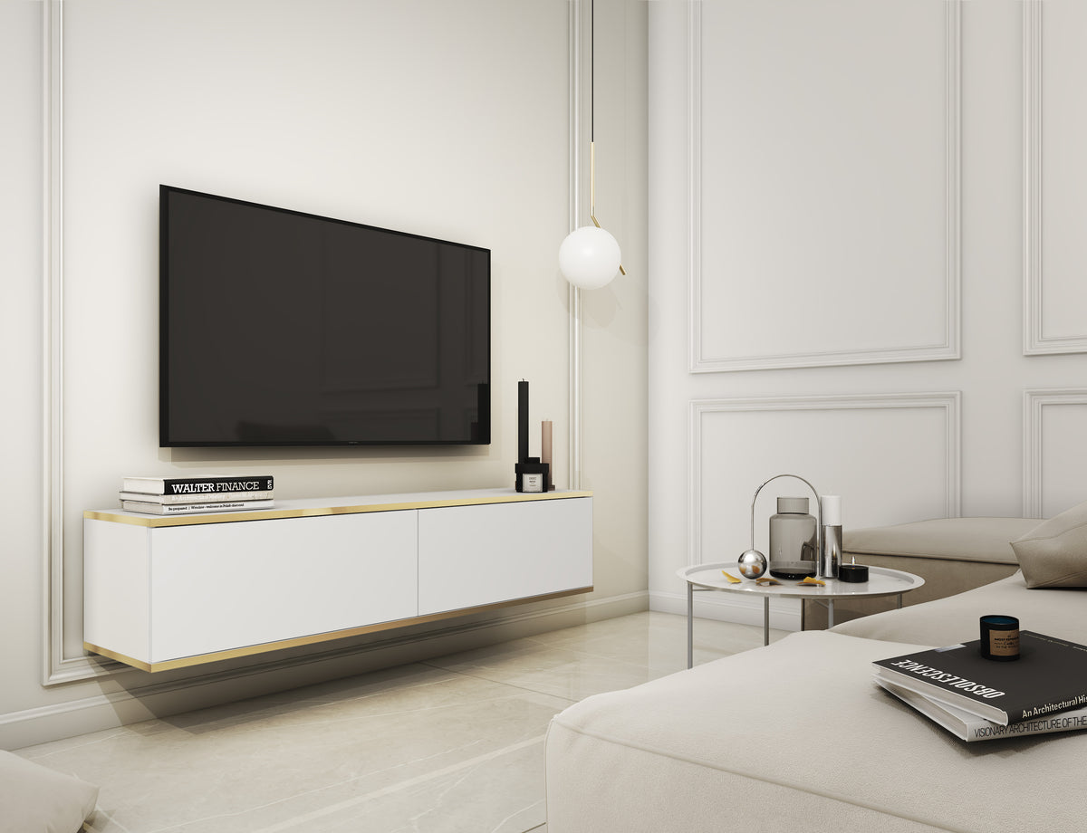 White two-door TV cabinet with gold trim, holding a flat-screen TV