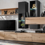 Living room wall unit with light wood cabinetry, black panels, and open shelves for TV