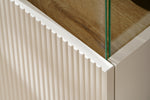 Ridged panel detail on cabinet edge with light oak top and glass
