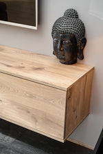 Wood media wall storage cabinet with closed lower drawer and curved head ornament