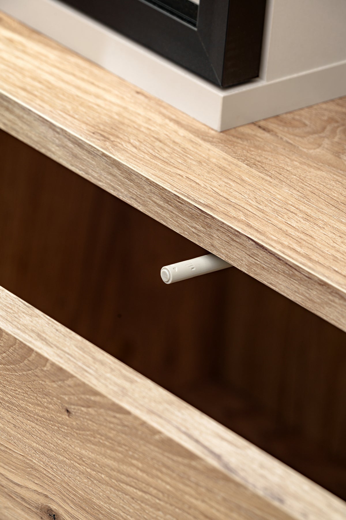 Wood media wall unit shelf with recessed cable outlet opening