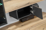 Open flip-door shelf showing interior storage with light wood front and black hinges