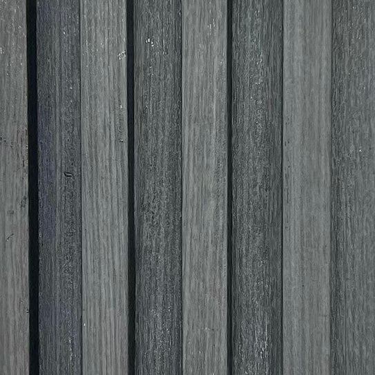 Dark grey vertical woodgrain wall panel texture, close-up