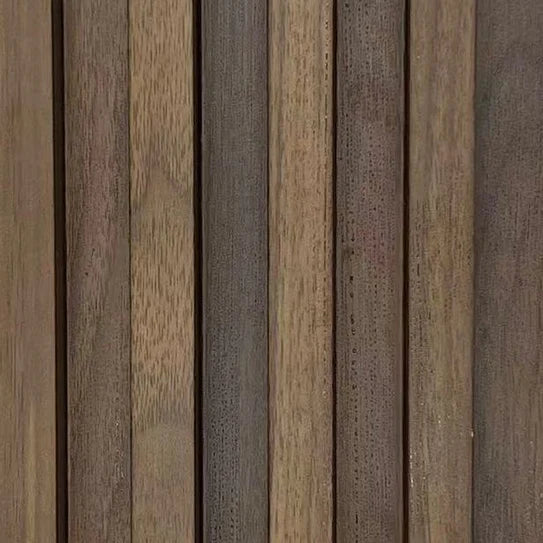 Close-up of vertical wood wall panel slats with tan, gray, and speckled grain