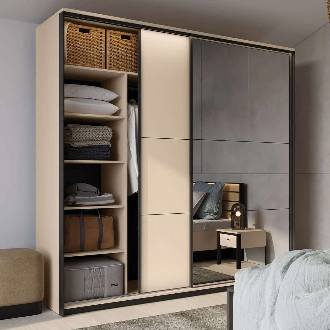 Sliding wardrobe with dark sliding doors; interior shelves with baskets and folded textiles