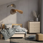 Beige chest of drawers with four drawers and black metal legs