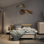 Sliding wardrobe with dark panel doors and open shelving, partially visible in room