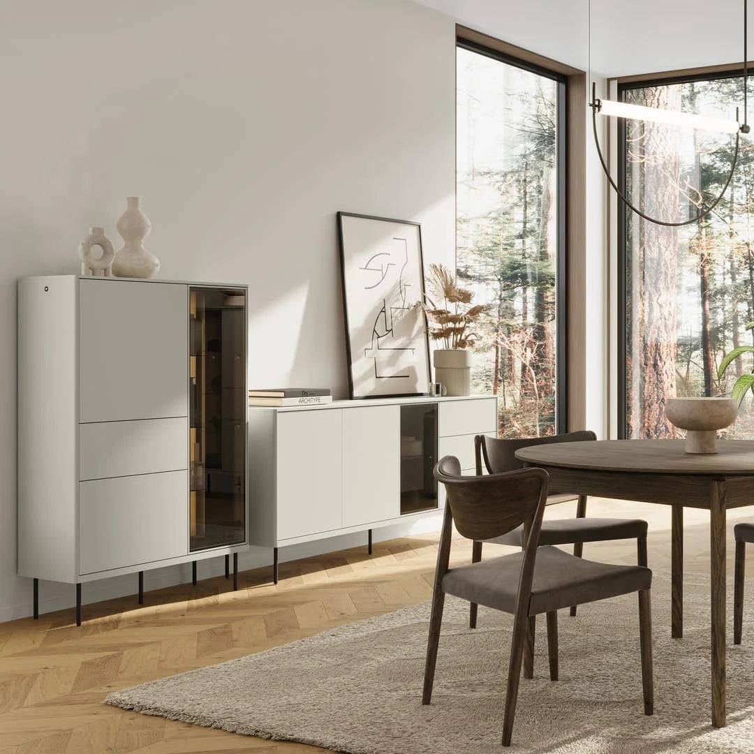 Long TV cabinet with open central bay and stacked drawers, light gray with black legs
