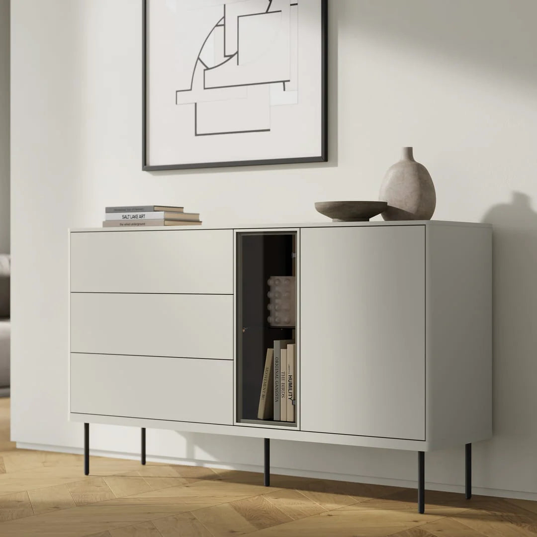 Light gray sideboard with multiple drawers and open book storage compartment