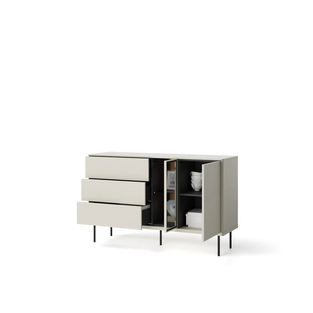Light gray sideboard with drawers and open shelves holding folded textiles