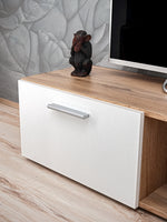White drawer-front media cabinet with light-wood side panel and pull handle