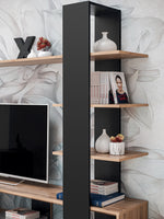 Black wall unit with open shelves and central vertical cabinet for TV accessories