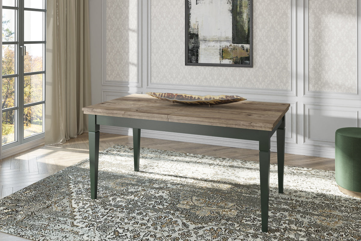 Extendable dining table with rustic wood top and dark green legs.