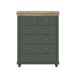 Dark green chest of drawers with light wood top, five drawers and round metal knobs.