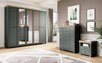 Dark gray bedside table with open shelf and two drawers, round brass knobs