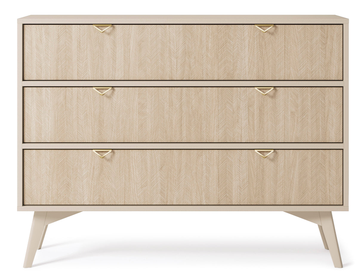 Light wood chest of drawers with three drawers and gold triangular handles, tapered legs