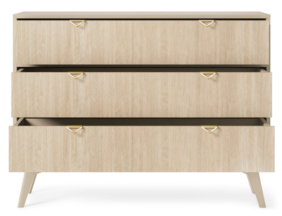 Light wood chest of drawers with three drawers, black trim lines, gold triangular handles