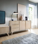 Wals 2-door sideboard in light wood-effect with drawers and cabinet doors; gray-green legs