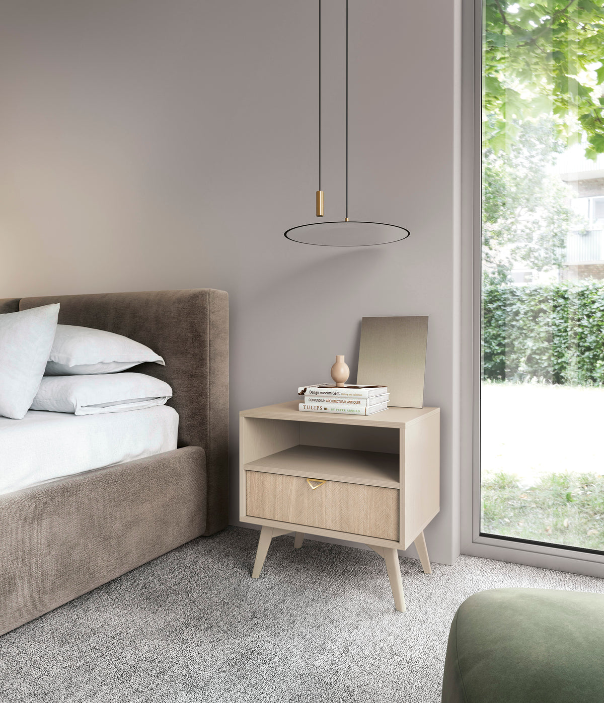 Olive green bedside table with open shelf and drawer, styled in a bedroom setting.